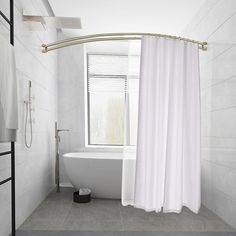 a white bath tub sitting next to a window