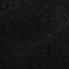 an image of a black background that looks like it is made out of paper or fabric