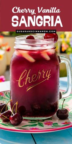 cherry vanilla sangria in a mason jar with cherries on the side and text overlay reading cherry vanilla sangria