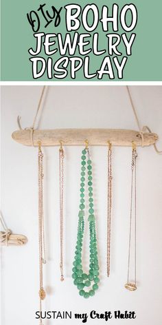 the diy boho jewelry display is made with wood, beads and metal chains