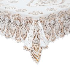 a white table cloth with lacy doily on the edge and an intricate design at the top