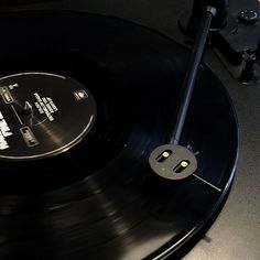 an old record player with its turntable removed from it's black vinyl cover