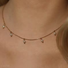 Discover our Dahlia Drop Pearl Necklace -- featuring a delicate 14k gold dainty chain adorned with lustrous drop bead pearls that dangle gracefully, creating a beautiful cascading effect.  Length: Adjustable 42+8cm Material: 14k Gold Overlay Chain, Drop Bead Pearls (4mm), Hypoallergenic Steel Design: Dainty Gold Chain with Dangling Drop Pearls Packaged in an eco-friendly, gift-ready box. Care Tips: Store in a jewelry box to maintain its shine. Image Copyright © Oh Orchid Drop Pearl Necklace, Jewelry Gold Necklace, Dainty Gold Chain, Weddings Gifts, Pearl Drop Necklace, Dainty Chain, Gold Overlay, Drop Beads, Steel Design