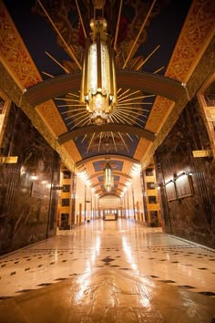 an ornately decorated lobby with chandelier and marble floors