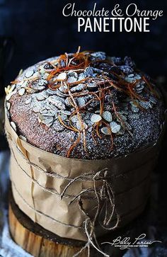 chocolate and orange panettoe cake on a wooden stand