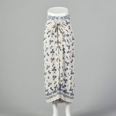 "This listing is for one skirt. The textile is viscose. Flowy, maxi skirt with two complimentary blue and white floral prints. The over skirt ties in the front creating a boho sarong style. The lightweight of the material would be great for the spring and summer. Condition Details: Very Good - Two 2cm spots on the right side front, one about 6\" down from the waistband and one about 10\" down from the waistband. Very very faint spot of yellow discoloration near the bottom front in a roughly 8\" Sarong Style, Flowy Maxi Skirt, White Maxi Skirt, Over Skirt, White Maxi Skirts, Blue And White Floral, White Maxi, Sarong, Boho Floral