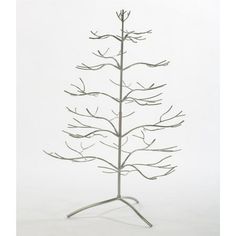 a metal christmas tree on a stand with no leaves and branches in the shape of a twig