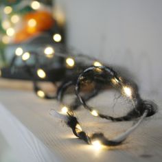 some string lights that are sitting on a shelf