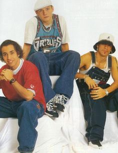 three young men sitting next to each other