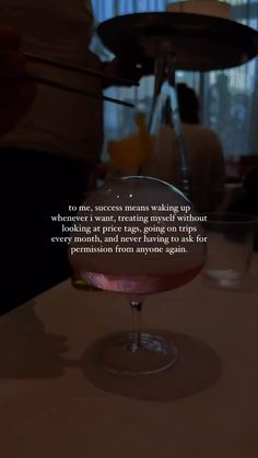 a pink drink sitting on top of a table