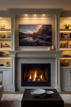 a living room with a fire place and built - in shelvings on the wall