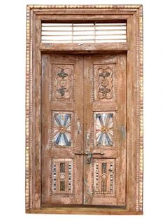 an old wooden door with glass inserts