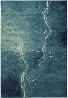 a blue area rug with lightning bolts on the top and bottom, in front of a dark background