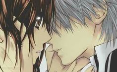 two anime characters one is kissing the other has his face close to his chest and eyes closed