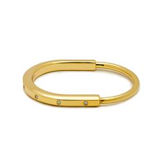 Tiffany & Co.  Lock Bangle in Yellow Gold with Diamond Accents Wrist Aficionado Polished Bangle Bracelet For Promise Occasion, Modern Hoop Bangle For Everyday, Modern Hoop Bangle For Everyday Wear, Everyday Yellow Gold Open Ring Bracelets, Everyday Yellow Gold Open Ring Bracelet, Modern Bracelets With Hidden Clasp For Gifts, Adjustable Open Ring Yellow Gold Bracelet, Modern Adjustable Hoop Cuff Bracelet, Modern Adjustable Oval Bangle