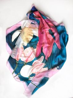 Square silk scarf- Magnolia's song/ Petroleum blue and pink scarf painted by hand/ Floral scarf/ Hand painted scarf/ Lightweight scarf ooak/ Women accessory blue/ Summer fashion scarf/ Blue, pink scarf with floral motif/ Unique handmade scarf/ Silk painting by Klara The silk has been painted with reactive dye that becomes part of the silk during the steaming process. They're colorfast and will last a lifetime. ►Wash by hand only! Wash in cold water! ►dimension 35'x35' Magnolias scarf painted on Artistic Hand Dyed Blue Silk Scarf, Artistic Blue Silk Scarf For Spring, Artistic Handmade Blue Silk Scarf, Handmade Pink Silk Scarf, Pink Hand Painted Silk Scarves, Handmade Pink Silk Scarves, Artistic Pink Silk Scarf For Summer, Artsy Blue Silk Scarf As Gift, Pink Artistic Scarf For Spring