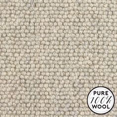 a close up shot of the texture of a carpet with white and beige colors on it