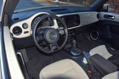 the interior of a car with dashboard and steering wheel