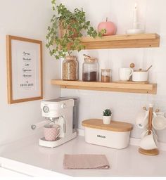 the kitchen counter is clean and ready to be used as a coffee bar or breakfast bar