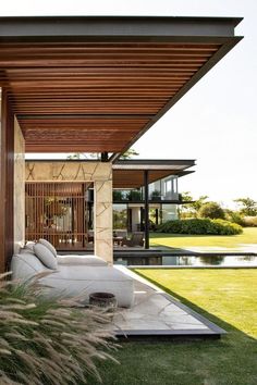 an outdoor living area with grass and plants