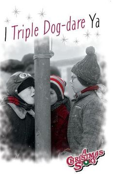 two people standing next to each other near a pole with the words triple dog - dare ya on it