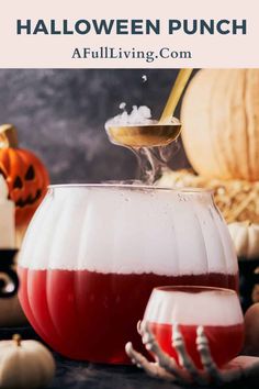 halloween punch in a pitcher and two glasses filled with liquid