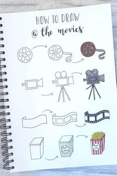 an open notebook with some drawings on it