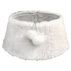 a white fur lampshade with a pom - pom hanging from the side