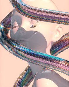 a white mannequin head with multicolored snakes around it