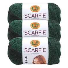 two skeins of yarn with the words scarfie on them in green and brown