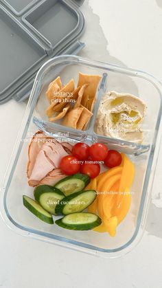 a plastic container filled with different types of food