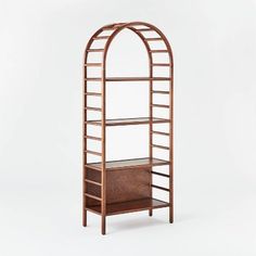 an arch shelf with drawers and shelves on it, against a white background in the shape of a bookcase