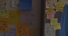 several sticky notes are attached to the wall