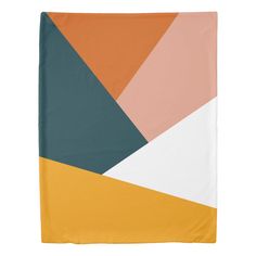 an orange, yellow and white blanket with geometric shapes on it's sides is shown