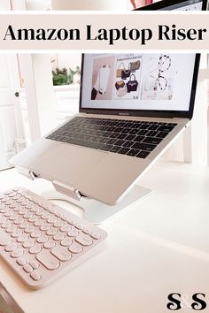 an open laptop computer sitting on top of a white desk