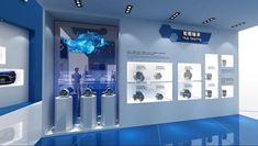 an exhibit room with blue and white walls