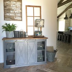 a living room with a book shelf and some baskets