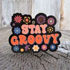 a sticker that says stay grooy with flowers and daisies on it