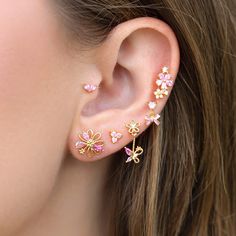 Blushing Blooms Earring Set Pink And Gold Earring Stack, Pink Flower-shaped Cubic Zirconia Jewelry, Elegant Pink Cubic Zirconia Flower Earrings, Pink Butterfly Charm Earrings, Elegant Pink Butterfly Charm Earrings, Elegant Pink Earrings With Butterfly Charm, Pink Whimsical Flower Earrings For Pierced Ears, Whimsical Pink Flower Earrings For Pierced Ears, Pink Feminine Flower Earrings