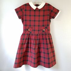 "- This adorable vintage dress is perfect for cooler weather! The fabric is a super soft velvet in a soft pink. It has short sleeves and buttons at back. There is a wide, off-white lace ruffle around the neck. The cut is a simple A-line shape. Size: approx 12 months Length: 14..5\"	is_active	6769639	Apparel & Accessories > Clothing > Baby & Toddler Clothing > Baby & Toddler Dresses	https://www.etsy.com/listing/616062825/vintage-60s-girls-pink-velvet-dress-with	clothing > Classic Short Sleeve Plaid Dress, Preppy Gingham Dress For School, Fitted Plaid School Dress, Fitted Plaid Dress For School, Red Short Sleeve School Dress, Casual Plaid Dress For School, Preppy Red Cotton Dress, Red Preppy Cotton Dress, Preppy Plaid Cotton Dress