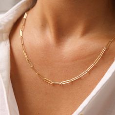 The Large Paperclip Chain Necklace is the statement piece you've been looking for. Bold enough to wow them and light enough to wear easy on your neck. You can match it with our other paperclip chain necklace for a layered look. Gold KT: 14K Solid Gold Gold Color: Yellow Gold Adjustable Chain Lengths: 14", 16", 18", 20" Chain Width: 3MM Link Length: 13MM Chain Style: Paperclip Chain Necklace Real Gold Necklace, Suede Jewelry, Real Gold Chains, Paperclip Chain Necklace, Gold Necklace Simple, Solid Gold Necklace, Solid Gold Chains, Dainty Gold Necklace, 14k Gold Necklace