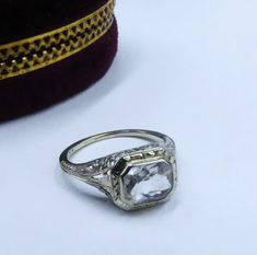 Antique Art Deco marked 10k white gold filigree & clear topaz/aquamarine? ring size 6, In good antique condition. The stone some scratch grom age, The pictures is part description.  Sold as is, The face of the ring 9 mm x 10 mm, Stone 8 mm x 6 mm. Weighs 2.4 gram. Thanks. Ship US only Vintage White Emerald Cut Ring, Vintage White Filigree Ring With Diamond Cut, White Vintage Filigree Ring With Diamond Cut, Vintage Diamond Crystal Ring With Gemstone, Antique White Filigree Ring With Diamond Cut, Vintage Silver Diamond Ring With Gemstone, Vintage Diamond White Gemstone Ring, Antique Silver Rose Cut Diamond Wedding Ring, Antique Silver Wedding Ring With Rose Cut Diamonds