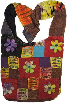 a multicolored patchwork bag with flowers on it