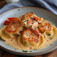 pasta with shrimp and sauce in a white bowl