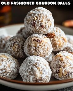 a white plate topped with powdered sugar covered doughnuts