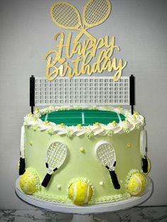 a birthday cake with tennis rackets on it