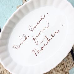 there is a white plate with writing on it