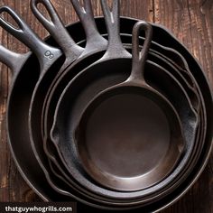 an assortment of cast iron pots and pans