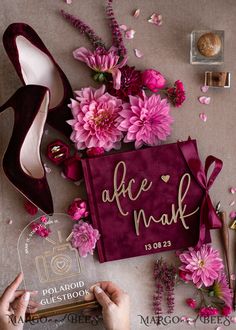 the bride's shoes and bouquets are laid out on the table