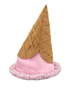 an ice cream cone hat with sprinkles on the top and pink base